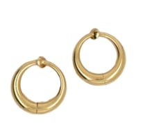 14k Yellow Gold Hoop Earrings: Classic, heavy-gauge everyday essential hollow hoop earrings sculpted in mirror-polished 14K yellow gold with sturdy click-down latch arch closures. Outer diameter: 32 mm; tube thickness: 4 mm.