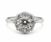 18k White Edwardian Period Diamond Ring: Breathtaking genuine historic Edwardian ring block. Crafted in 18K white gold, showcasing intricate openwork lace filigree undergalleries and fine milgraining, centering three prominent old European c
