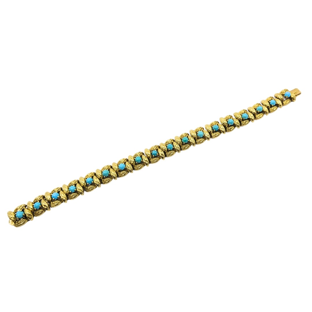 Mauboussin Paris 18k Gold Turquoise Link Bracelet, 1960s: Rare 1960s French haute joaillerie signed Mauboussin Paris. A striking structural 18K yellow gold flexible brick-link bracelet, beautifully punctuated by set rows of perfectly matched, smooth robin's 