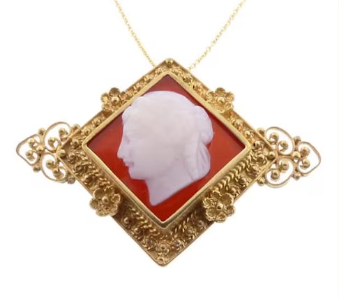 Victorian Etruscan Carnelian Cameo Goddess of Liberty Pendant & Brooch: Outstanding 19th-century Etruscan revival historic ornament. A heavy 14K yellow gold oval frame accented with delicate wire twisted ropes and granulation work, framing an exquisitely hand-carved natur