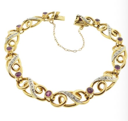 French Edwardian 18K Gold, Platinum, Diamond Ruby Fancy Link Bracelet: Exquisite turn-of-the-century French import line bracelet. Constructed from alternating elongated 18K yellow gold geometric openwork frame links topped in fine platinum plates, meticulously bead-set w