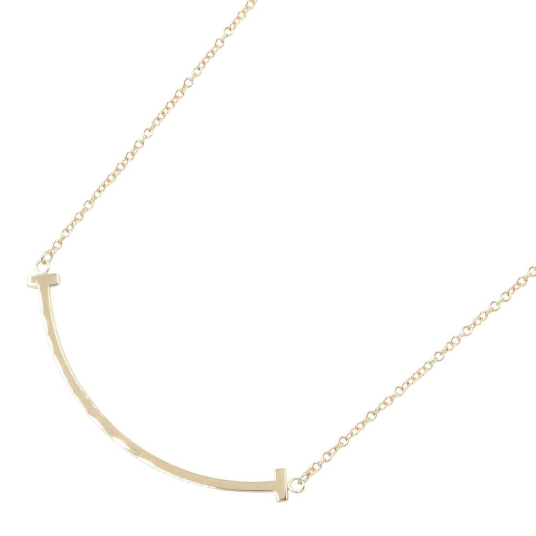 Tiffany & Co. T Smile Small Necklace, 18K (Yellow Gold), Women's Jewelry, Gold Tone: --- Catalog ---Category: SizePendant Size: 3mm x 37mm / 0.11'' x 1.45''Neck Circumference: 40.5 cm - 45.5 cm / 15.94'' - 17.91''Category: DesignColor: GoldGender: WomenMaterial: Yellow gold (18K)Neckl
