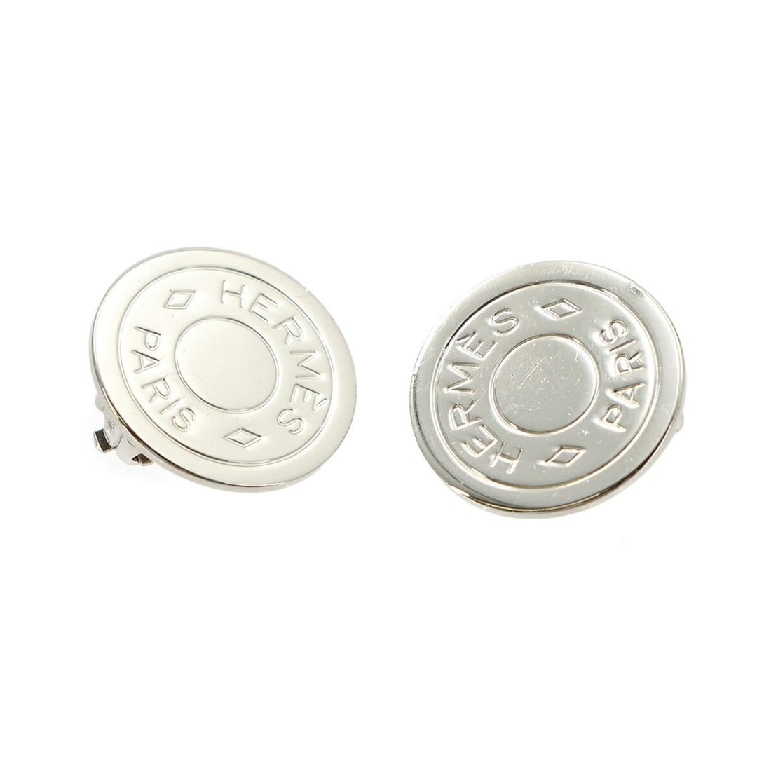 Hermes Sellier Earrings, Silver: --- Catalog ---Category: SizeSize (HxWxD): 20.00mm x 20.00mm / 0.79'' x 0.79''Category: DesignType: Clip earringsColor: SilverGender: WomenCategory: GeneralBrand: Hermes--- Item List ---Section: Condi