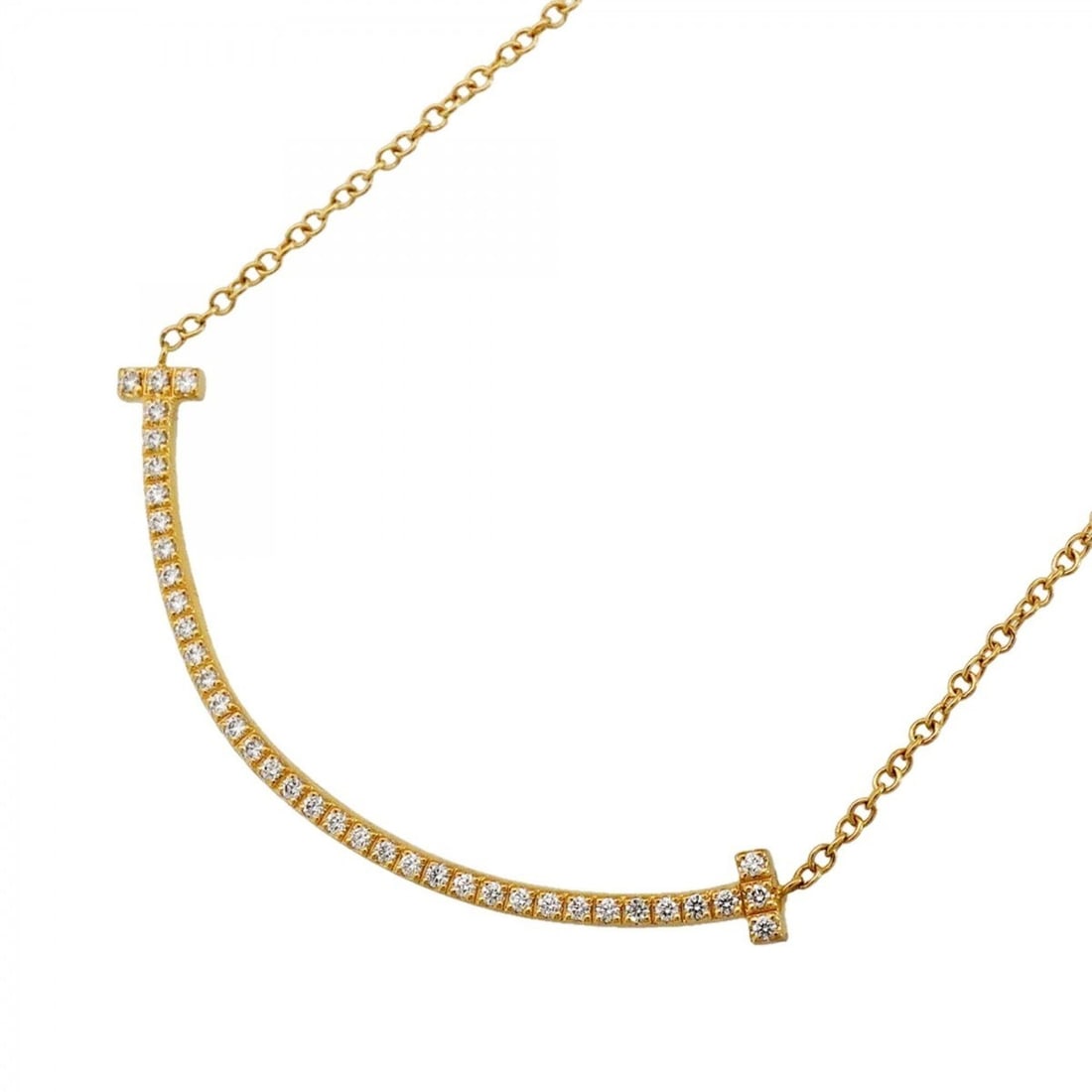 Tiffany & Co. T Smile Small Necklace, 18K Yellow Gold, Diamond, Women's: --- Catalog ---Category: SizePendant Size: 10.7mm x 35.6mm / 0.42'' x 1.4''Neck Circumference: 41.5 cm / 16.33''Category: DesignStone: DiamondGender: WomenMaterial: Yellow gold (18K)Necklace Type: Nec