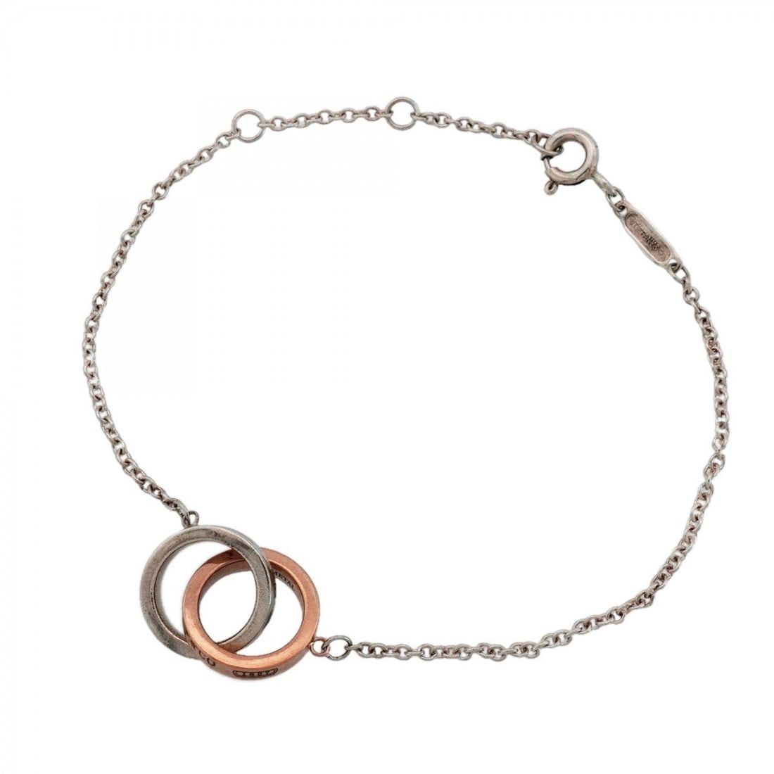 Tiffany & Co. Interlocking Bracelet 1837, Sterling Silver 925, Rubedo Metal, Ladies': --- Catalog ---Category: SizeLength: 17.5cm / 6.88''Category: DesignType: Charm braceletGender: WomenMaterial: Silver 925Category: GeneralBrand: Tiffany--- Item List ---Section: ConditionRanking: Rank