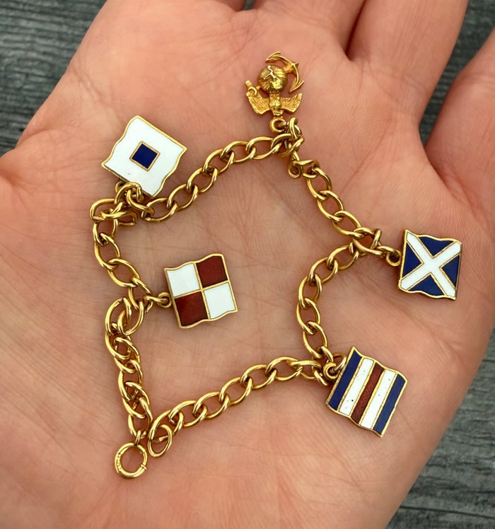 Vintage Enamel Maritime Flag Charm Bracelet in 10K Gold (S): 10K gold bracelet featuring several enamel nautical signal flags.