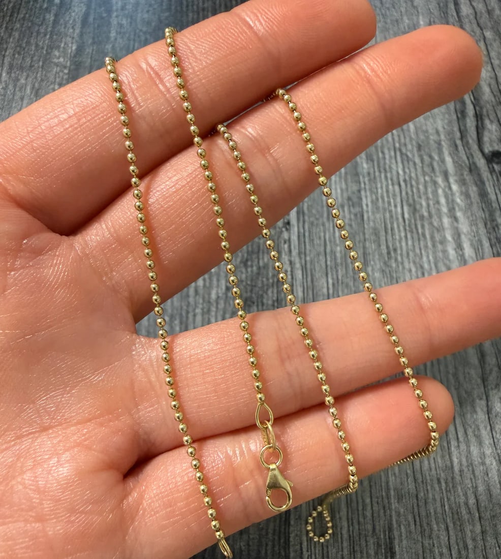 14K Gold 1.5 mm Ball Chain, 20" Long: Metal: 14K Yellow GoldWeight: 5 gramsMeasurements: 20 inches long by 1.5 mm wideMarkings: "14KT ITALY"Condition: In very good condition with only minor surface wear.
