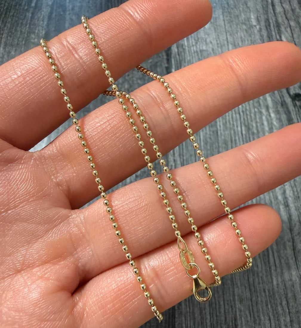 14K Gold 1.5 mm Ball Chain, 18" Long: Metal: 14K Yellow Gold Weight: 4.4 gramsMeasurements: 18 inches long by 1.5 mm wideMarkings: "14K ITALY"Condition: In very good condition with only minor surface wear.