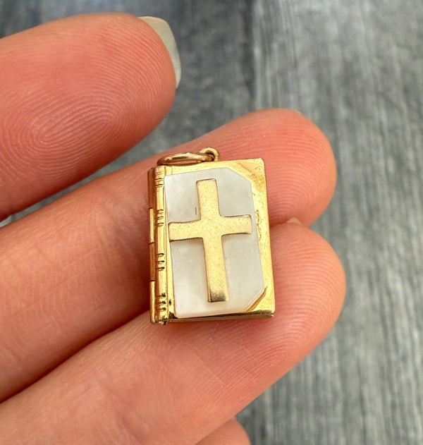 Mother of Pearl Bible Book Locket: A unique 14K gold "Holy Bible" locket with mother of pearl covers and the Lord's Prayer, designed to hold tiny photos.