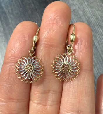 Two Tone 10K Gold Dangling Mandala Earrings: Intricate 10K yellow and white gold earrings featuring a circular mandala-inspired filigree design.
