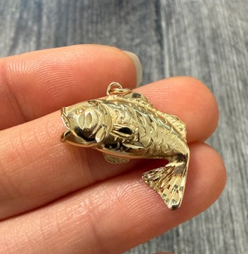 14K Gold Fish Charm: A solid 14K yellow gold articulated fish charm with fine scale detailing and a polished finish.