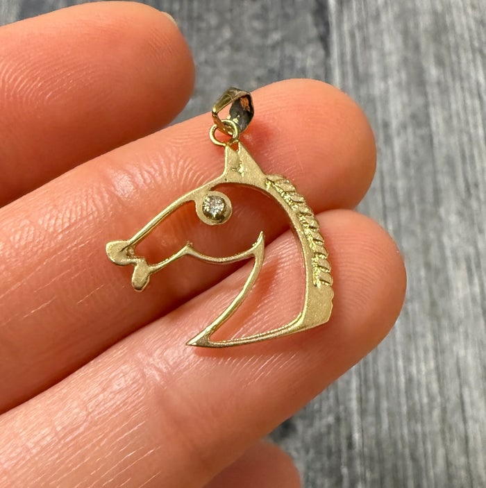 Diamond Eye Horse Charm in 14K Gold: A small, detailed 14K gold horse profile charm featuring a tiny genuine diamond for the eye.