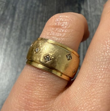 Wide Vintage Diamond and 14K Gold Cigar Band: A bold, wide 14K gold "cigar band" style ring set with a row of brilliant-cut diamonds.