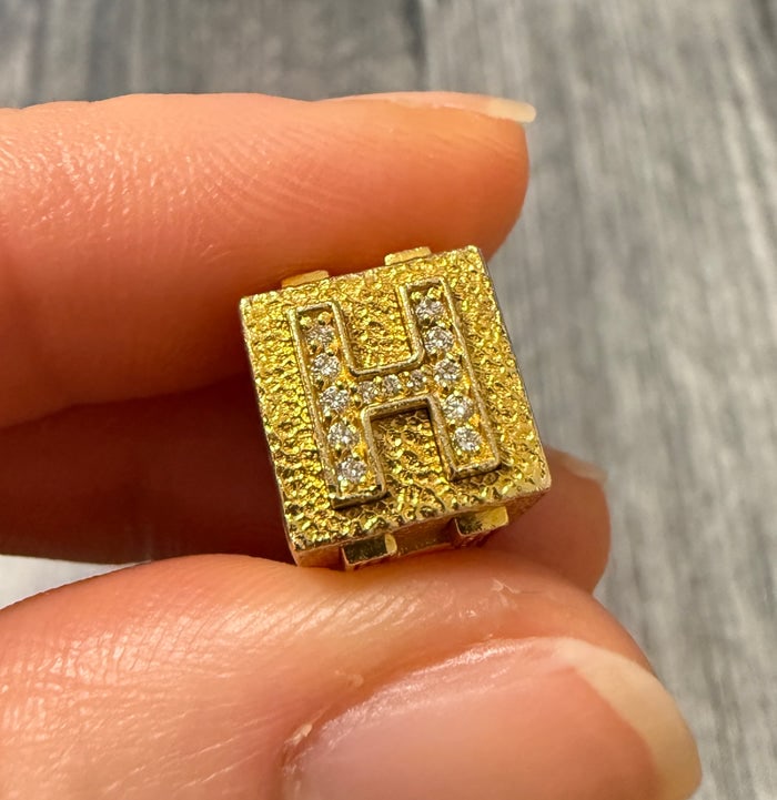 Diamond and 14K Gold Initial "H" Cube Slider Charm: A heavy 14K gold block or cube-shaped slider charm featuring a diamond-encrusted letter "H".