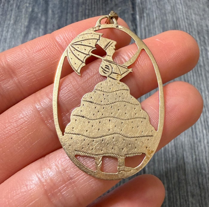 Large Vintage 14K Gold Mary Poppins Charm: A nostalgic and detailed 14K gold charm depicting the iconic Mary Poppins with her umbrella and bag.