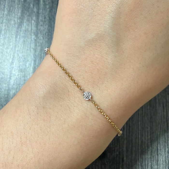 Diamond Station and 14K Gold Cable Link Bracelet: A 7.5-inch 14K gold bracelet featuring delicate cable links interrupted by shimmering diamond stations.