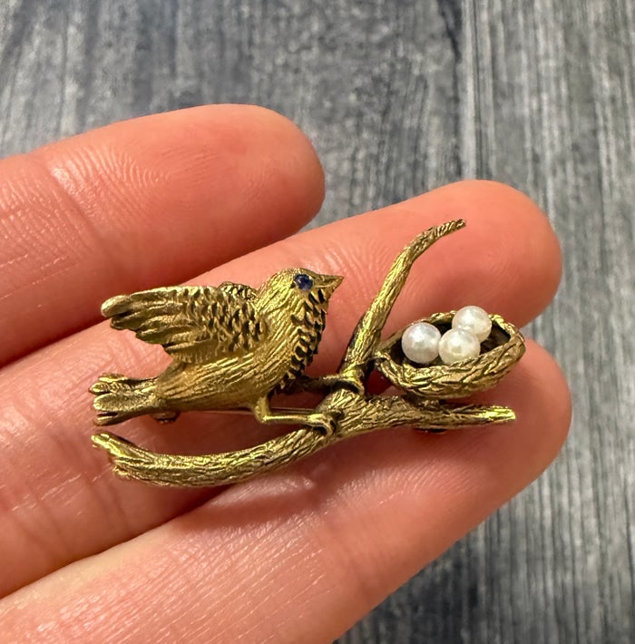 Vintage 14K Gold Bird and Pearl Nest Pin (S): A delicate vintage pin depicting a gold bird tending to a nest with a tiny seed pearl "egg."