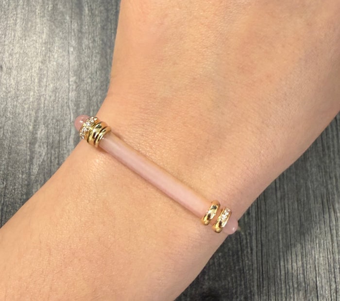 Elongated Rose Quartz Bar and Diamond Bangle in 14K Gold: 14K gold bangle set with an elongated rose quartz bar and diamonds.