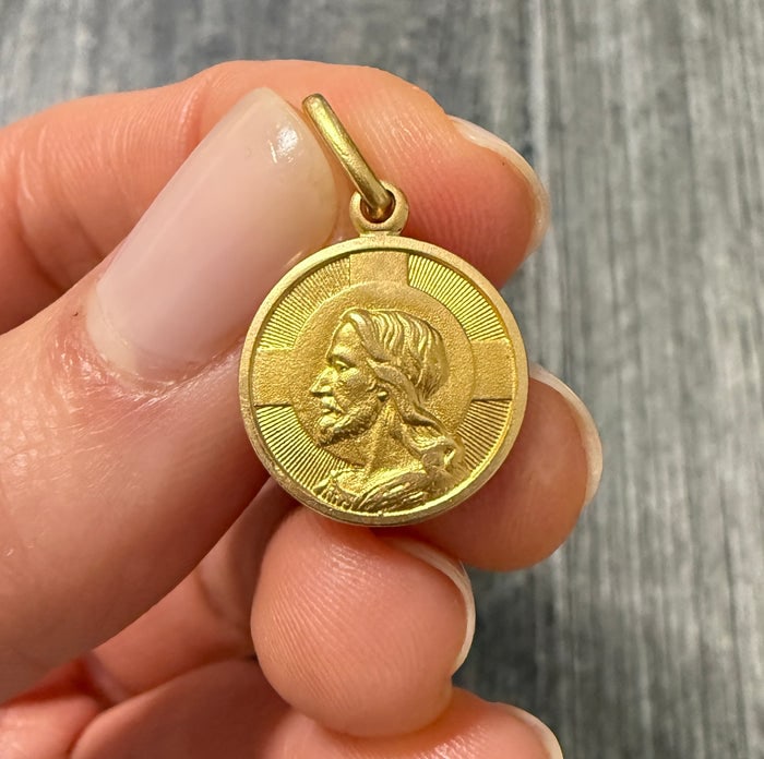 18K Gold Jesus Charm: Religious charm crafted in 18K gold.