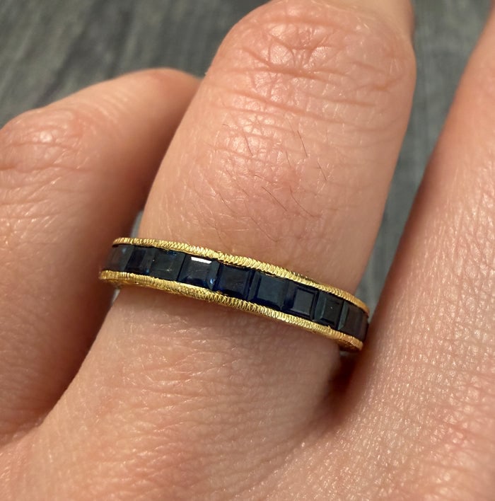 Sapphire and 18K Gold Chased Eternity Band, Size 7: Size 7 eternity band in 18K gold with chased details and sapphires.