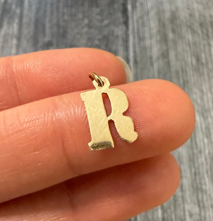 18K Gold Block Letter Initial R Charm: 18K gold charm in the shape of the initial 'R'.
