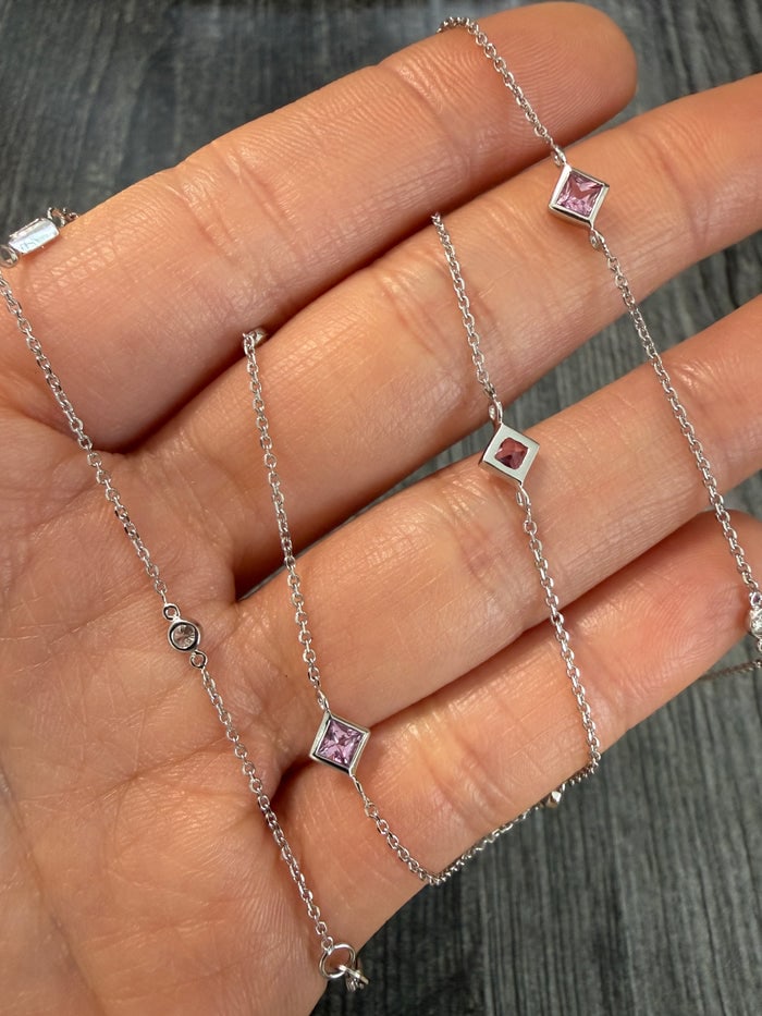 Diamond and Pink Topaz Station Chain, 16" Long: 16-inch gold chain featuring diamond and pink topaz stations.