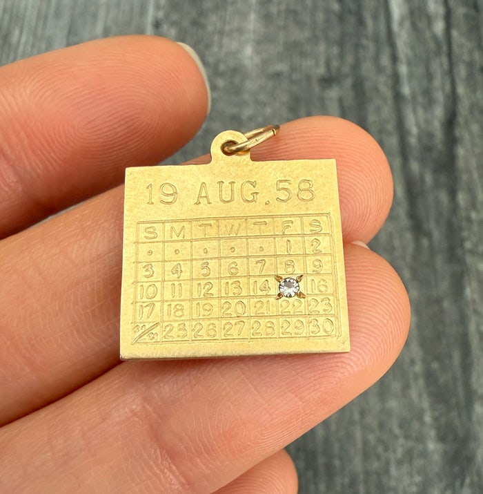 Vintage 14K Gold "August 15" Calendar Charm: 14K gold charm depicting a calendar page for August 15.