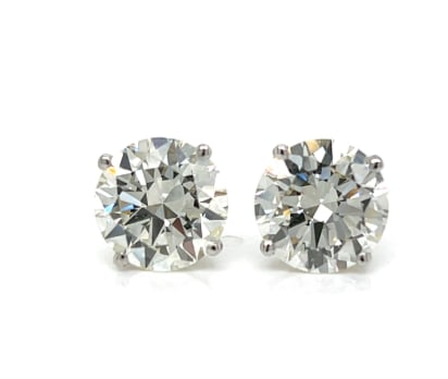 14K White Gold GIA Certified 6.02 Ct. Diamond Stud Earrings: A pair of GIA Certified diamond studs totaling 6.02 carats. High-clarity stones set in traditional 14K white gold four-prong baskets.