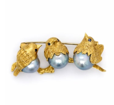 Italian 18K Yellow Gold Pearl Birds Brooch: A whimsical Italian-made brooch featuring gold birds with pearl accents, crafted in fine 18K yellow gold.