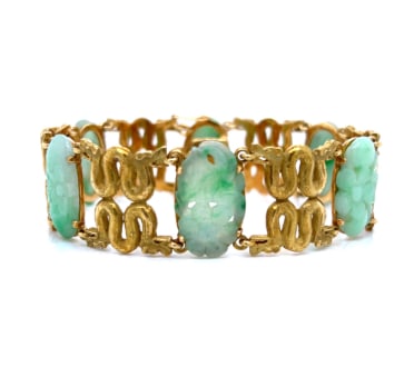 1960’s 18K Yellow Gold Carved Jade Bracelet: 18K Yellow Gold; 1960's vintage featuring intricately Carved Jade.