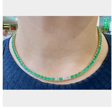 14K Yellow Gold Emerald & Diamond Necklace: 14K Yellow Gold; vibrant Emerald center with Diamond accents.