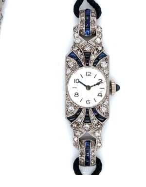 Art Deco Platinum Diamond & Sapphire Watch: Platinum; Art Deco era timepiece set with Diamonds and Sapphires.