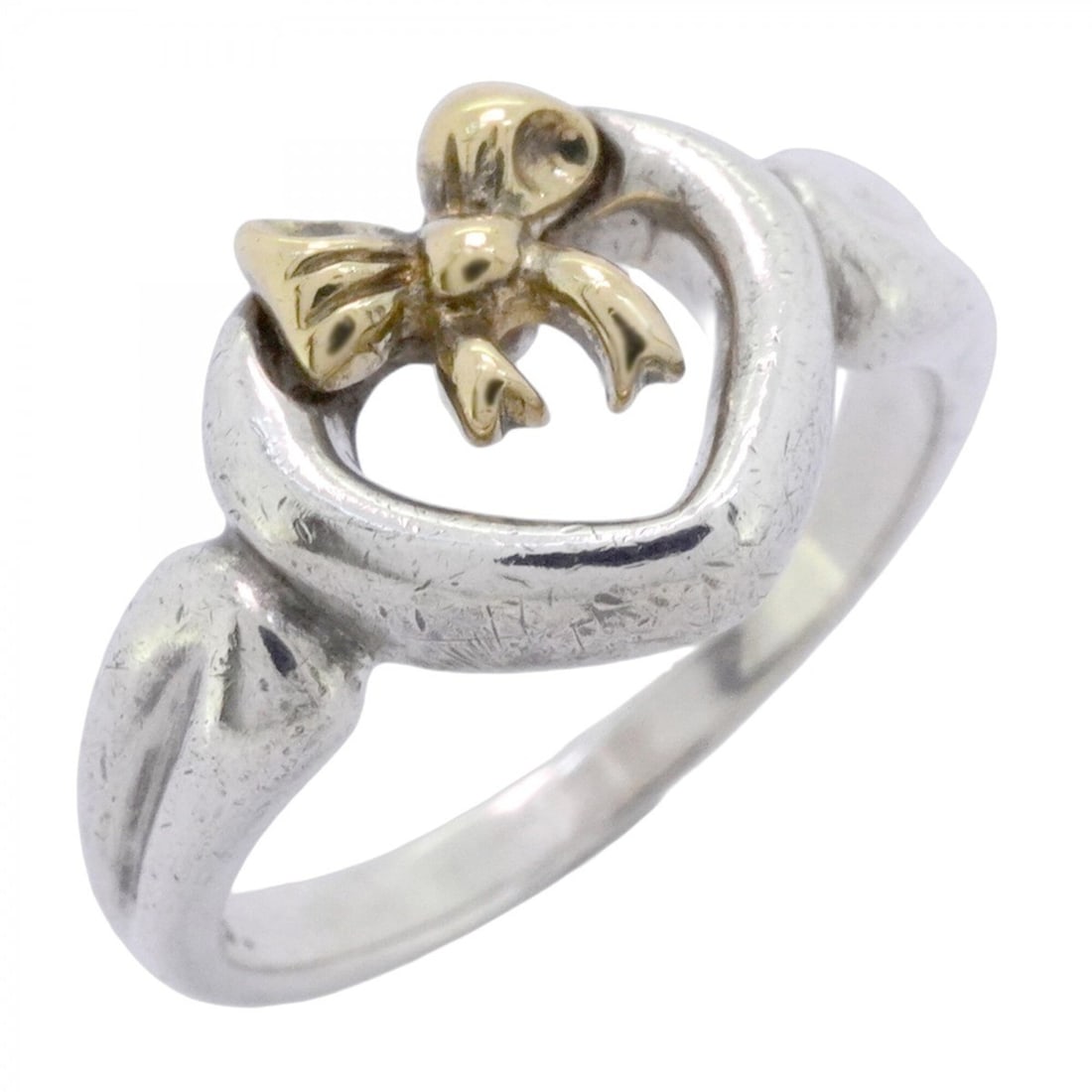 Tiffany & Co. Heart Ribbon Ring, 18K Yellow Gold (KYG), Sterling Silver 925, Size 11, Women's: --- Catalog ---Category: SizeJP Size: 11US Size: 6Category: DesignType: Band ringGender: WomenMaterial: Silver 925, Yellow gold (18K)Category: GeneralBrand: Tiffany--- Item List ---Section: ConditionR
