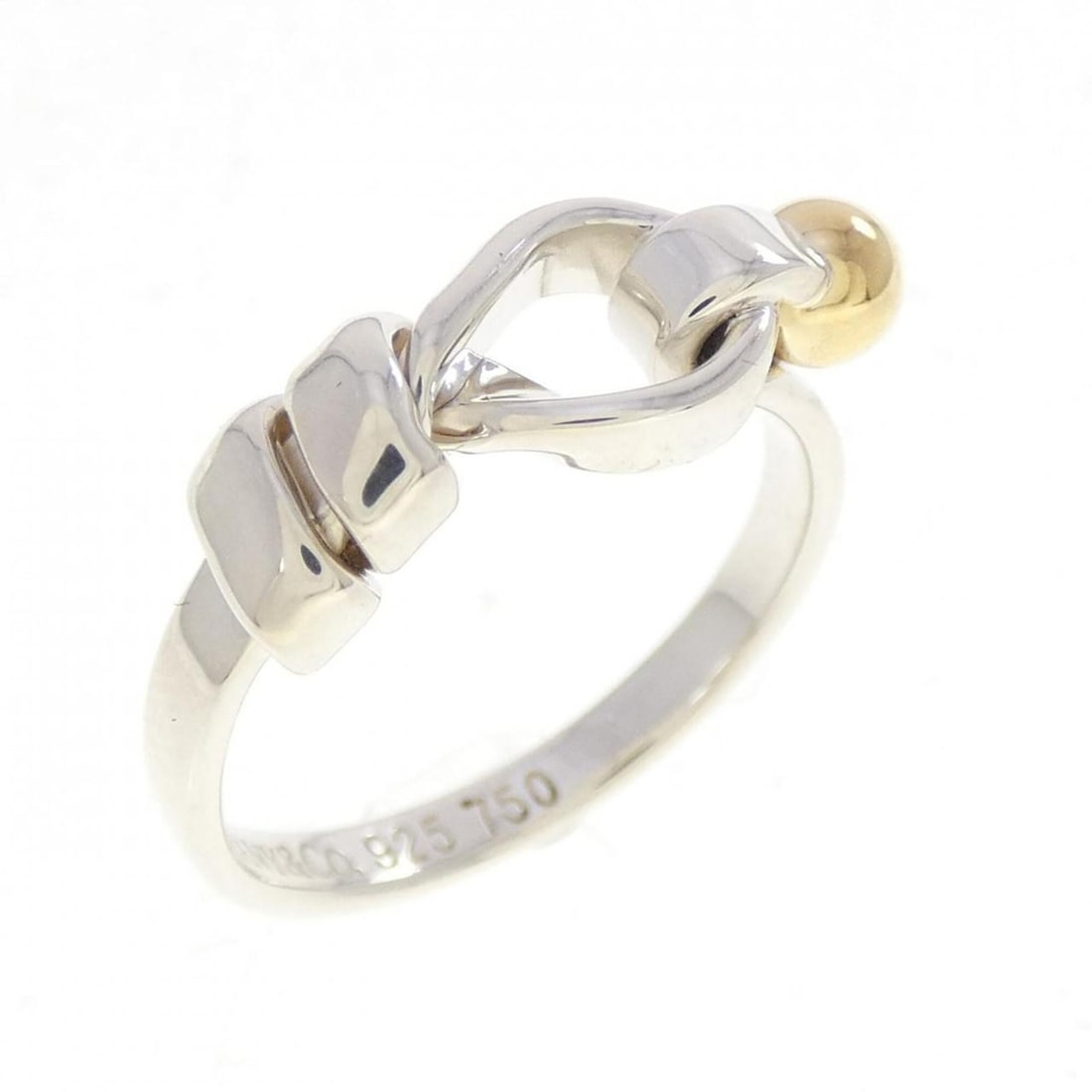 Tiffany & Co. Flat Wire Love Knot Ring: --- Catalog ---Category: SizeJP Size: 10.5US Size: 5.5Category: DesignType: Band ringGender: WomenMaterial: Silver 925, Yellow gold (18K)Category: GeneralBrand: Tiffany--- Item List ---Section: Condit
