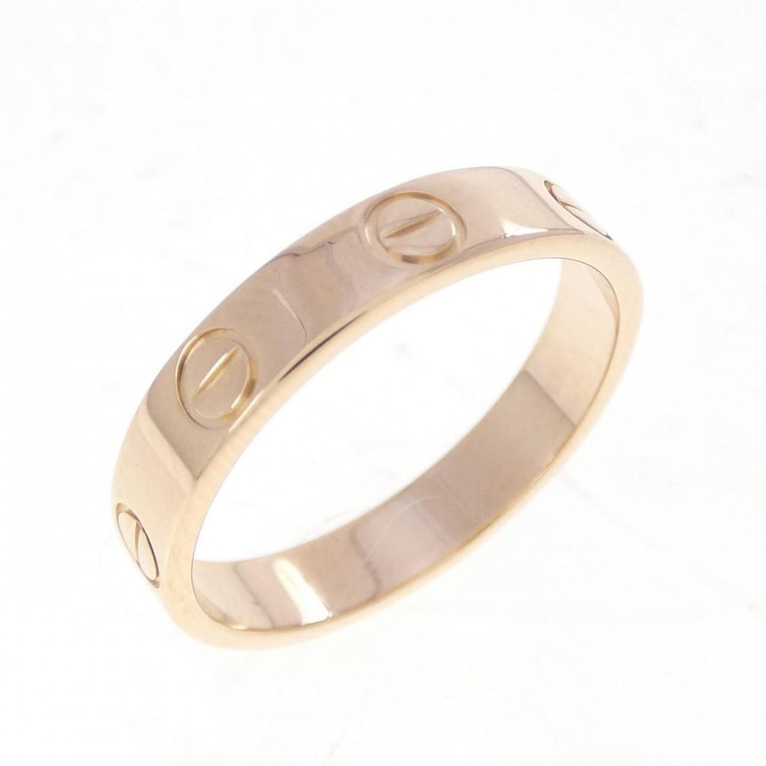 Cartier Mini Love Ring: --- Catalog ---Category: SizeUS Size: 6.5Brand Size: 52Category: DesignType: Band ringGender: WomenMaterial: Pink gold (18K)Category: GeneralBrand: Cartier--- Item List ---Section: ConditionRanking: R