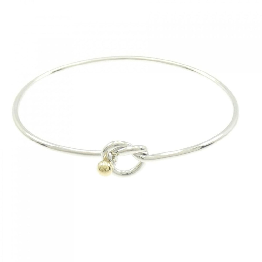 Tiffany & Co. Flat Wire Hook Eye Heart Bangle: --- Catalog ---Category: SizeLength: 17cm / 6.69''Category: DesignType: BangleGender: WomenMaterial: Silver 925, Yellow gold (18K)Category: GeneralBrand: Tiffany--- Item List ---Section:
