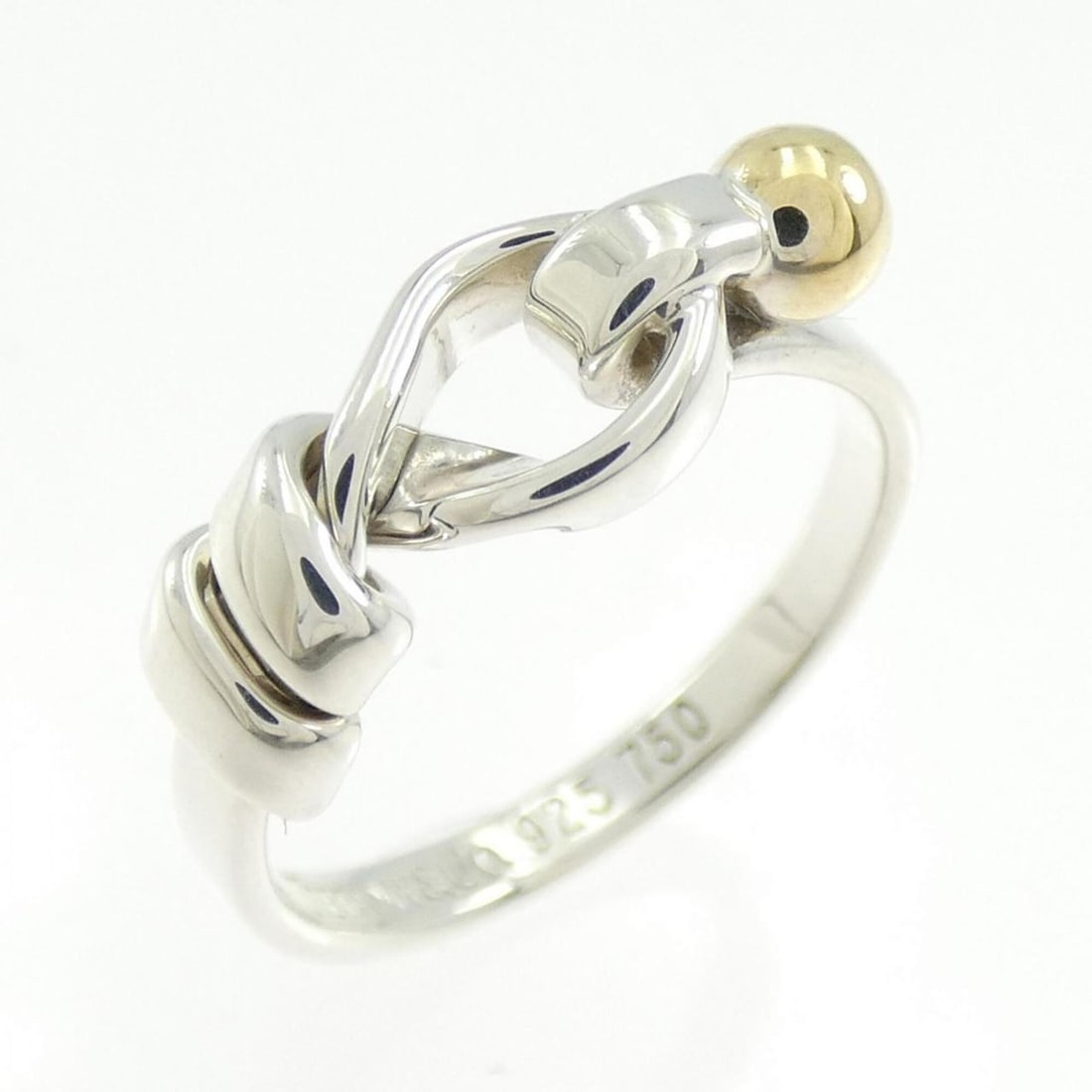 Tiffany & Co. Flat Wire Love Knot Ring: --- Catalog ---Category: SizeJP Size: 10.5US Size: 5.5Category: DesignType: Band ringGender: WomenMaterial: Silver 925, Yellow gold (18K)Category: GeneralBrand: Tiffany--- Item List ---Section: