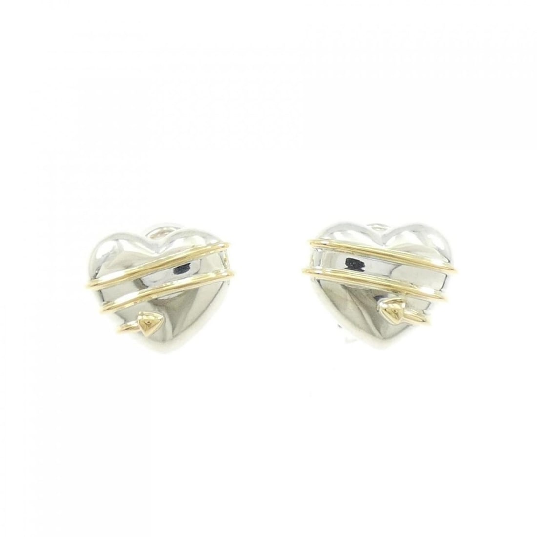 Tiffany Heart Earrings: --- Catalog ---Category: SizeSize (HxWxD): 13.00mm x 15.90mm / 0.51'' x 0.63''Category: DesignType: Clip earringsGender: WomenMaterial: Silver 925, Yellow gold (18K)Category: GeneralBrand: Tiffany--- 