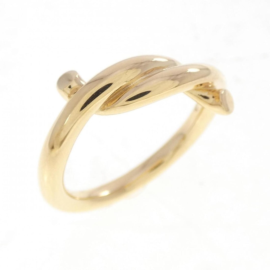 Cartier Entrelacés Ring: --- Catalog ---Category: SizeUS Size: 3.5Brand Size: 46Category: DesignType: Band ringGender: WomenMaterial: Yellow gold (18K)Category: GeneralMPN: B40886Brand: Cartier--- Item List ---Section: Condit