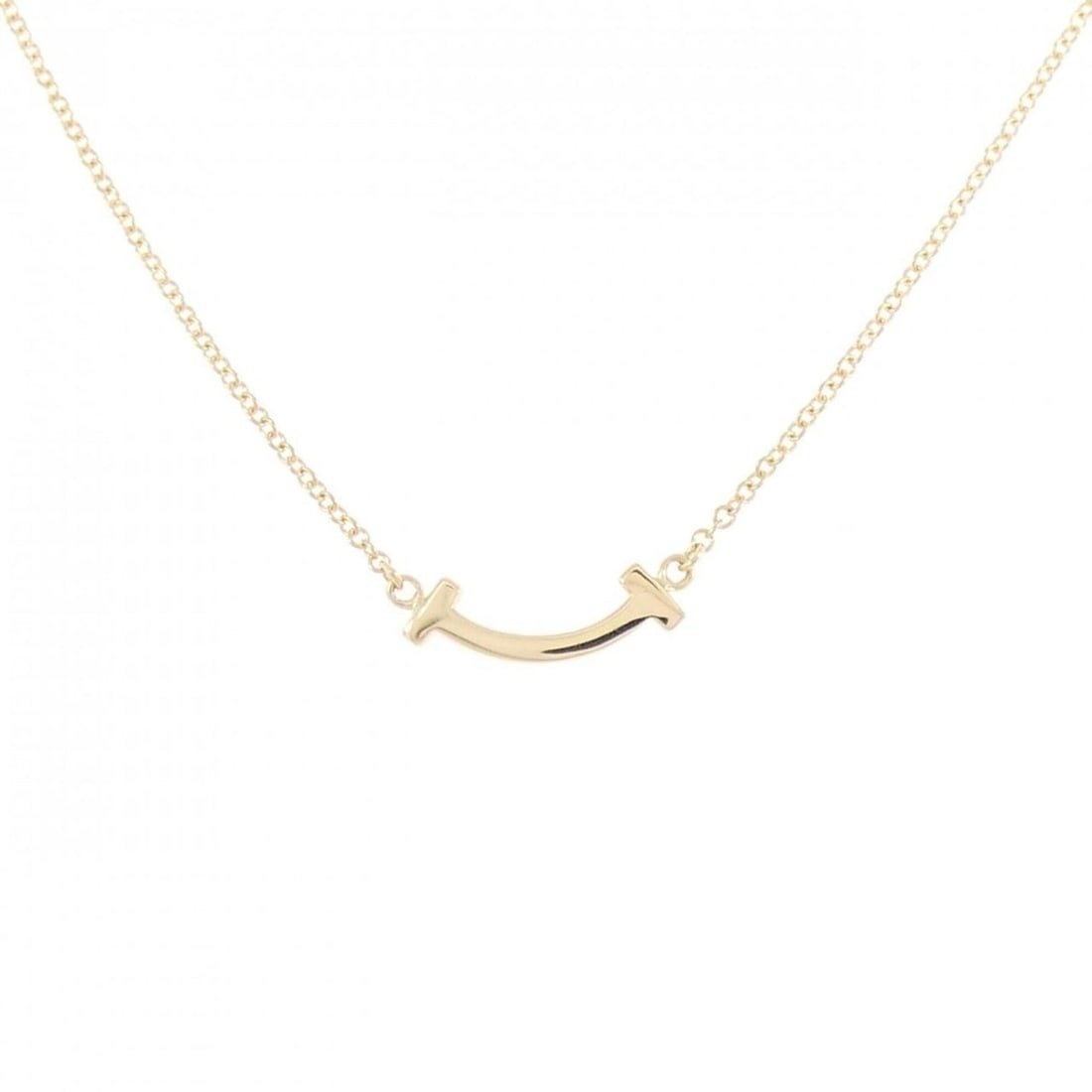 Tiffany T Smile Mini Necklace: --- Catalog ---Category: SizePendant Size: 3.6mm x 13.4mm / 0.14'' x 0.52''Neck Circumference: 41 cm - 46 cm / 16.14'' - 18.11''Category: DesignGender: WomenMaterial: Yellow gold (18K)Pendant Type: