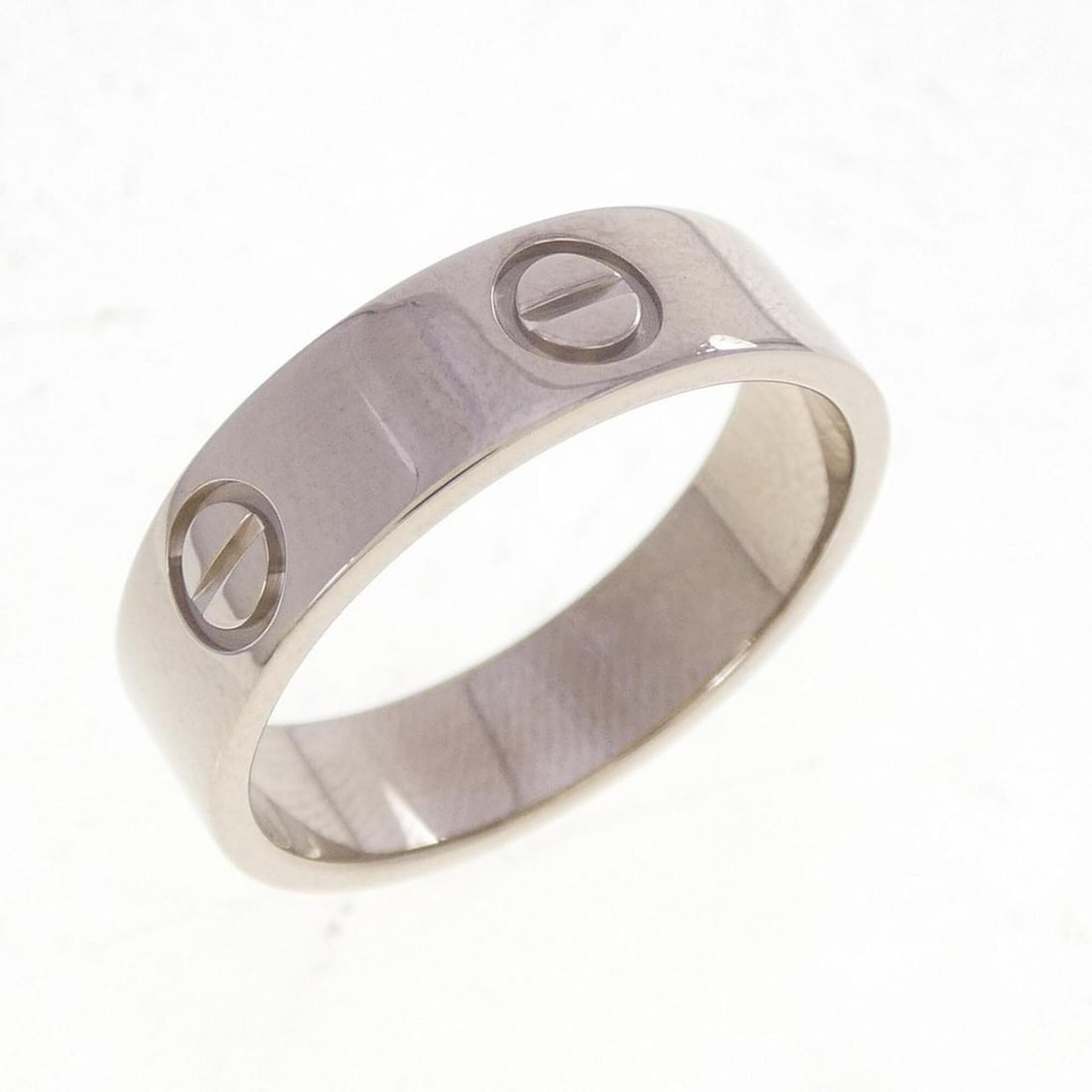 Cartier Love Ring: --- Catalog ---Category: SizeUS Size: 8.5Brand Size: 57Category: DesignType: Band ringGender: Men,WomenMaterial: White gold (18K)Category: GeneralMPN: B4084700Brand: Cartier--- Item List ---Section: C