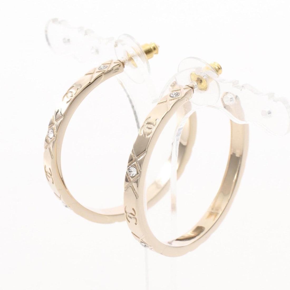 Chanel Coco Mark Hoop Earrings, Gold Plated (GP) Rhinestone Women's, Gold/Clear Tones: --- Catalog ---Category: SizeSize (HxWxD): 40.00mm x 40.00mm / 1.57'' x 1.57''Category: DesignType: Hoop earringsColor: GoldStone: RhinestoneFinish: Gold platedGender: WomenStone Color: ClearCategory: