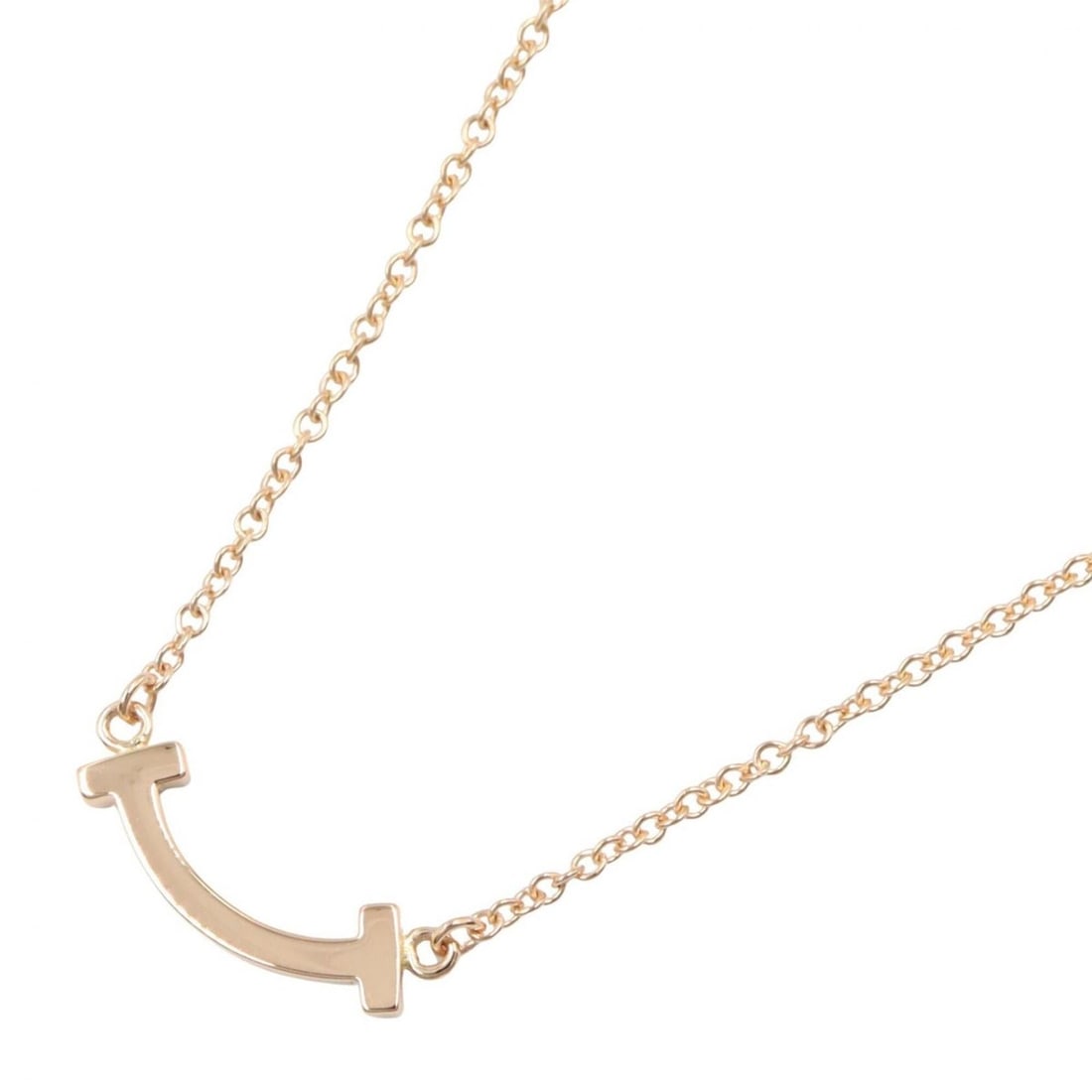 Tiffany & Co. T Smile Mini Necklace, 18K Pink Gold (PG), Women's, Tone, Item Number 62617721: --- Catalog ---Category: SizePendant Size: 3mm x 14mm / 0.11'' x 0.55''Neck Circumference: 40.5 cm - 45.5 cm / 15.94'' - 17.91''Category: DesignColor: GoldGender: WomenMaterial: Pink gold (18K)Necklac