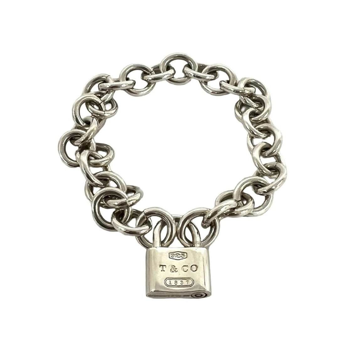 TIFFANY&Co. Tiffany Padlock Bracelet, Sterling Silver 925, Chain Accessory, Item No. 34798: --- Catalog ---Category: SizeLength: 17.5cm / 6.88''Category: DesignType: Charm braceletColor: SilverGender: WomenMaterial: Silver 925Category: GeneralBrand: Tiffany--- Item List ---Section: Condition