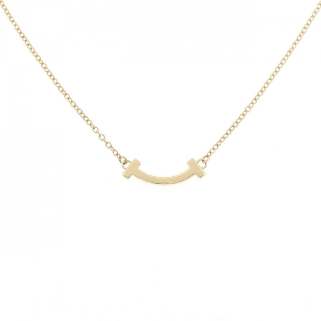 Tiffany T Smile Mini Necklace: --- Catalog ---Category: SizePendant Size: 3.6mm x 13.4mm / 0.14'' x 0.52''Neck Circumference: 41 cm - 46 cm / 16.14'' - 18.11''Category: DesignGender: WomenMaterial: Yellow gold (18K)Pendant Type:
