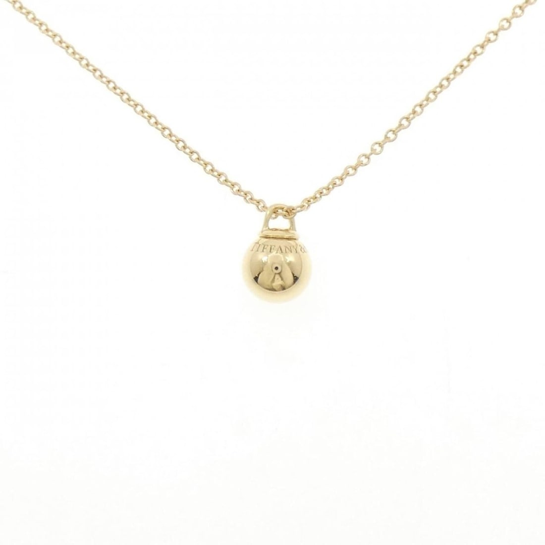Tiffany Ball Necklace: --- Catalog ---Category: SizePendant Size: 10.8mm x 7.6mm / 0.42'' x 0.29''Neck Circumference: 41 cm - 46 cm / 16.14'' - 18.11''Category: DesignGender: WomenMaterial: Yellow gold (18K)Necklace Type: