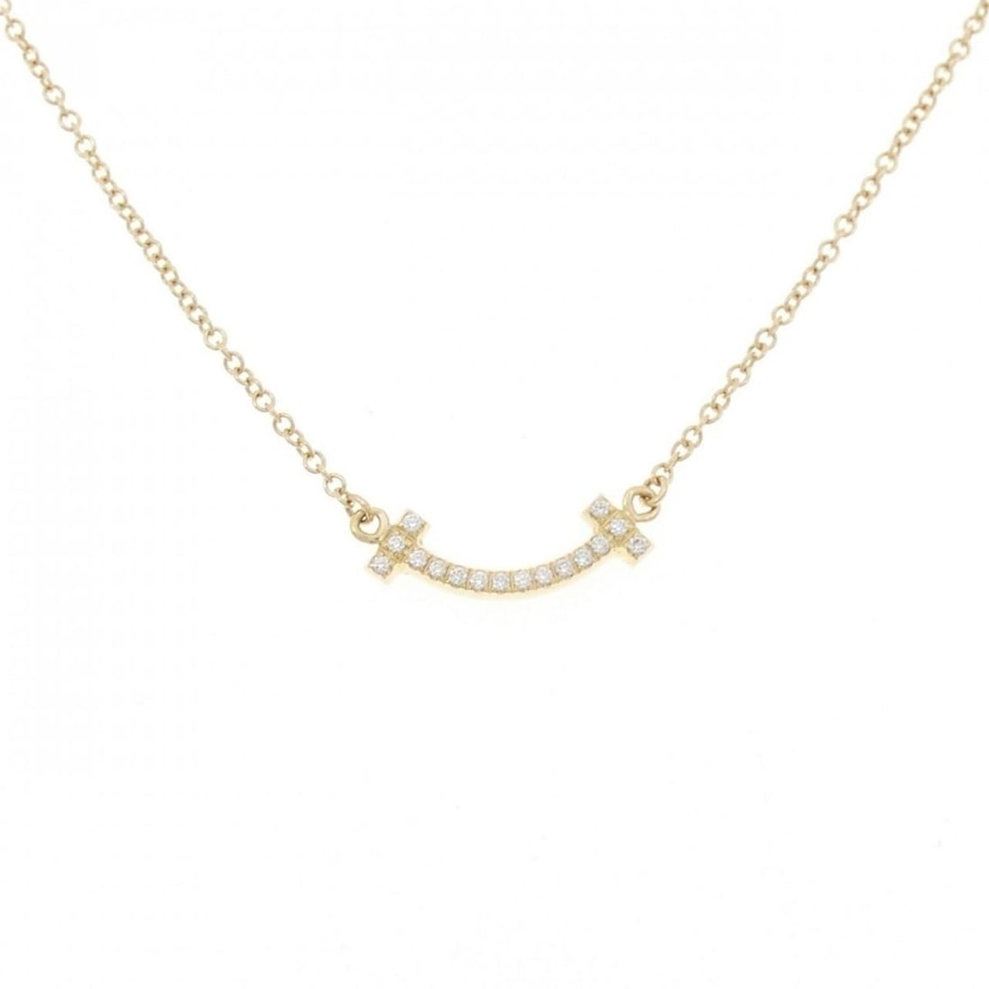 Tiffany T Smile Mini Necklace: --- Catalog ---Category: SizePendant Size: 3.6mm x 13.4mm / 0.14'' x 0.52''Neck Circumference: 46 cm / 18.11''Category: DesignColor: Yellow goldGender: WomenMaterial: Yellow goldPendant Type:
