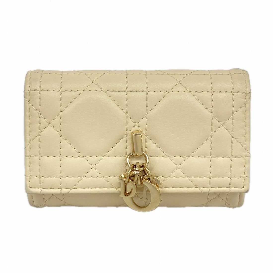 Christian Dior Accessories Key Case Cannage Leather Ivory Champagne Women's: --- Catalog ---Category: DesignType: KeycaseColor: IvoryGender: WomenMaterial: Leather Category: GeneralBrand: Christian DiorCategory: Physical PropertiesSize (HxWxD): 7cm x 11cm x 2.5cm / 2.75'' x 4.