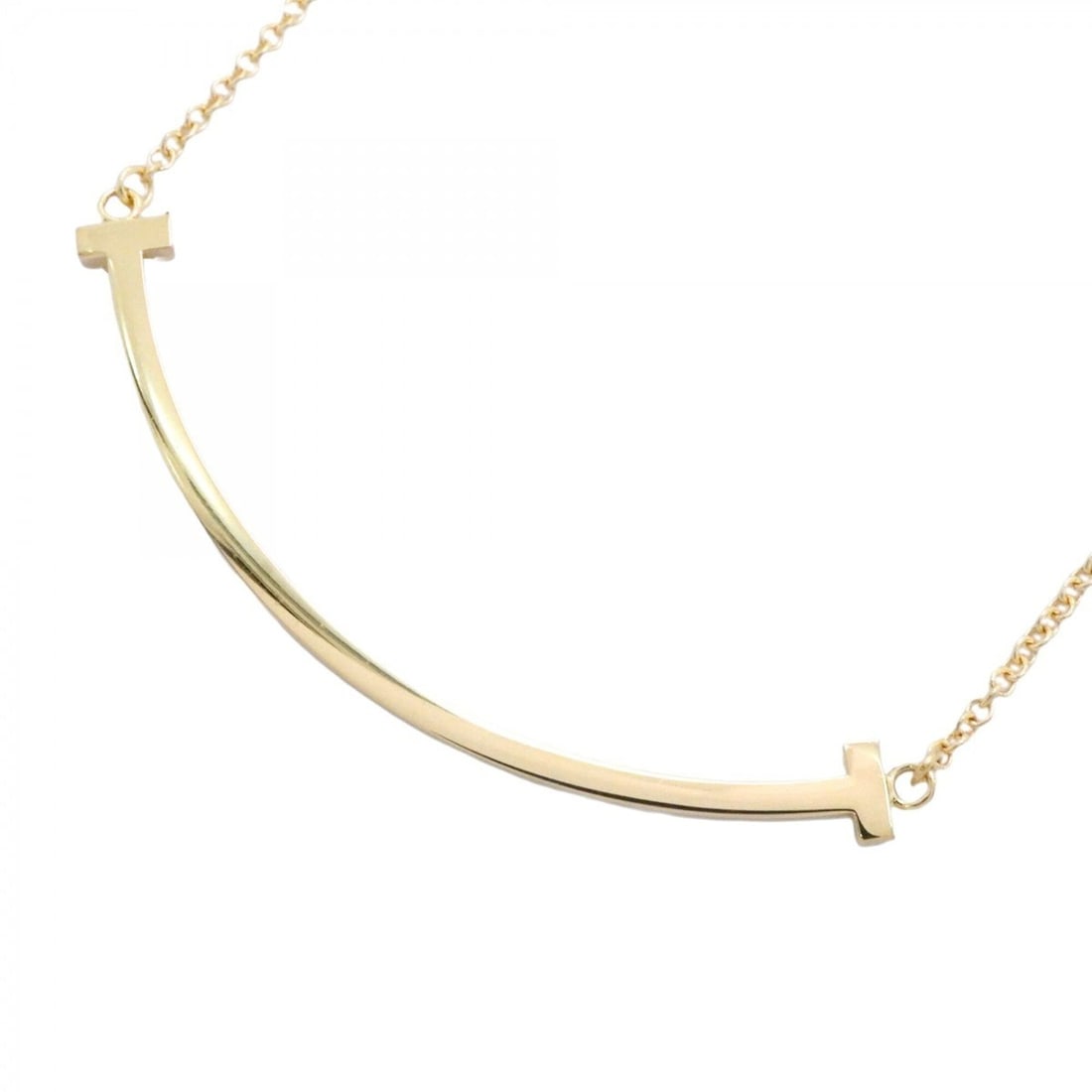 Tiffany & Co. T Smile Small Necklace, 18K Yellow Gold, Women's: --- Catalog ---Category: SizePendant Size: 10mm x 37.2mm / 0.39'' x 1.46''Neck Circumference: 40.5 cm - 45.5 cm / 15.94'' - 17.91''Category: DesignGender: WomenMaterial: Yellow gold (18K)Necklace Type