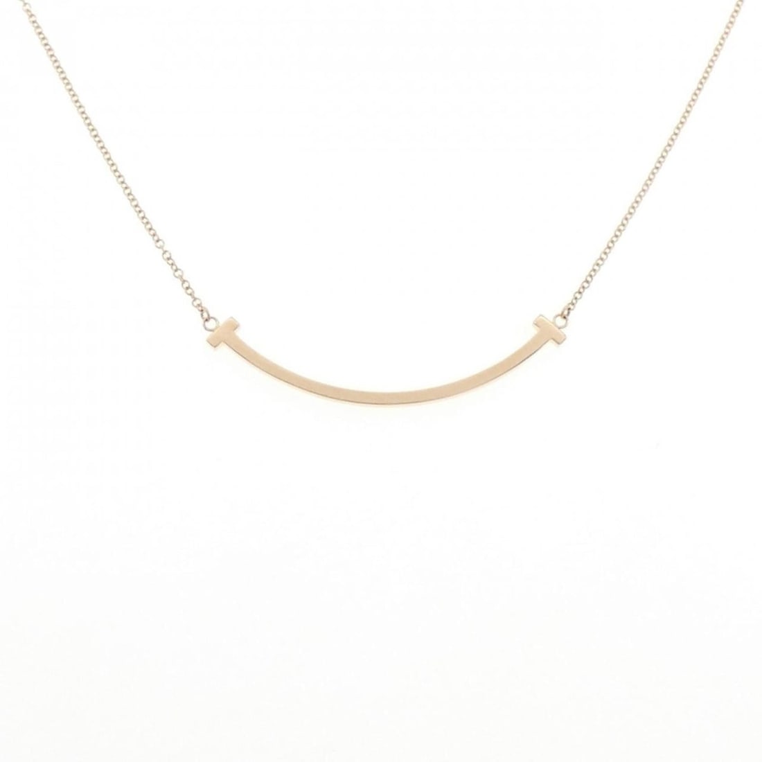 Tiffany T Smile Small Necklace: --- Catalog ---Category: SizePendant Size: 3.8mm x 37.5mm / 0.14'' x 1.47''Neck Circumference: 40 cm - 46 cm / 15.74'' - 18.11''Category: DesignGender: WomenMaterial: Pink gold (18K)Pendant Type: Pend